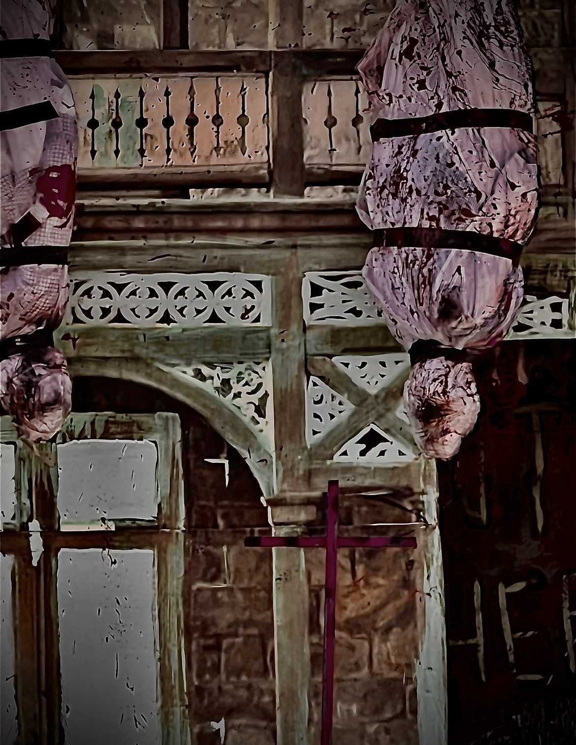 Blood-soaked wrapped bodies hanging from the rafters of the haunt
